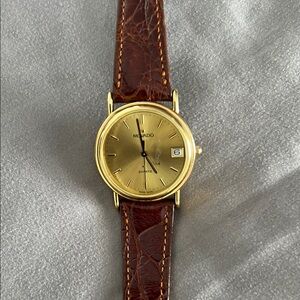 Movado Gold and Brown women’s watch